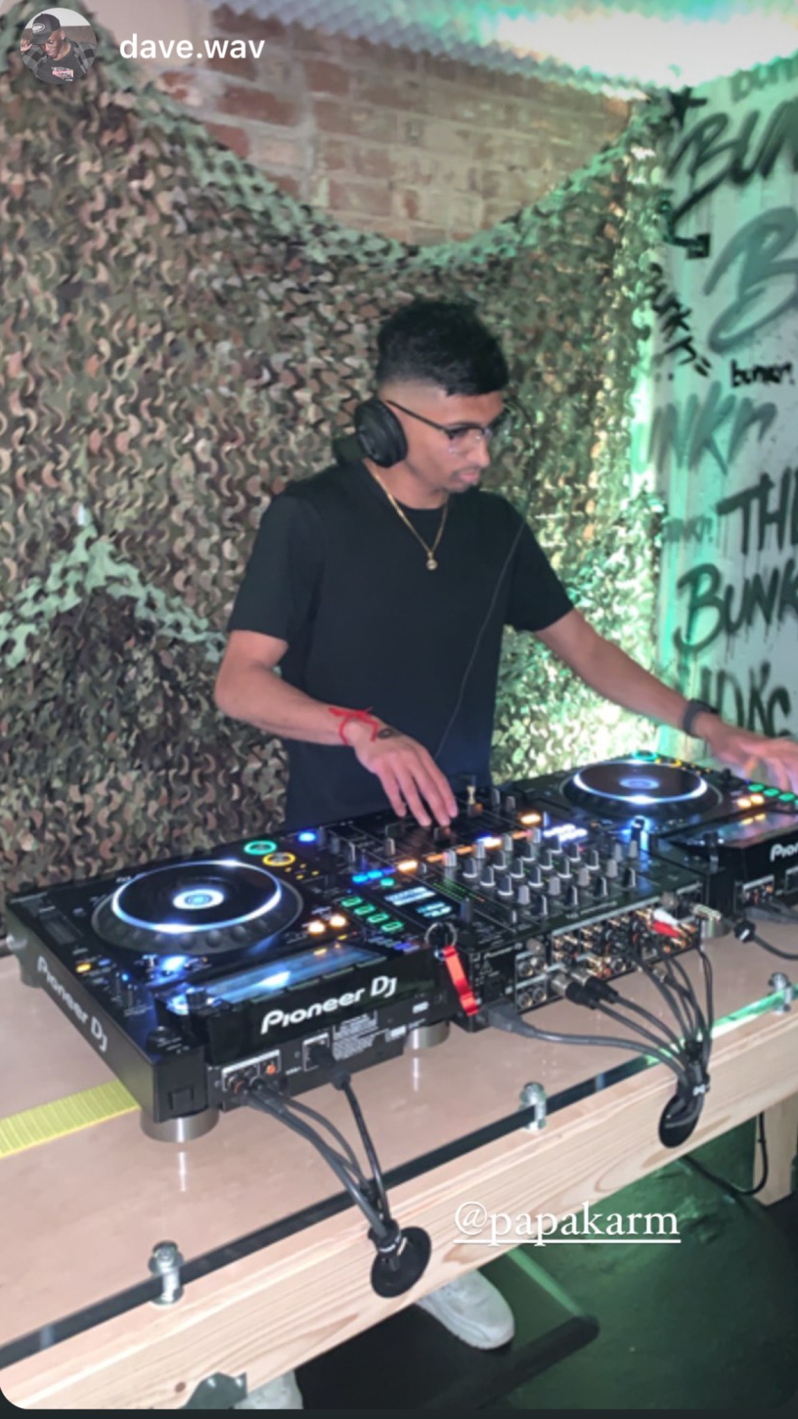 DJ Karmabeats performing behind the decks