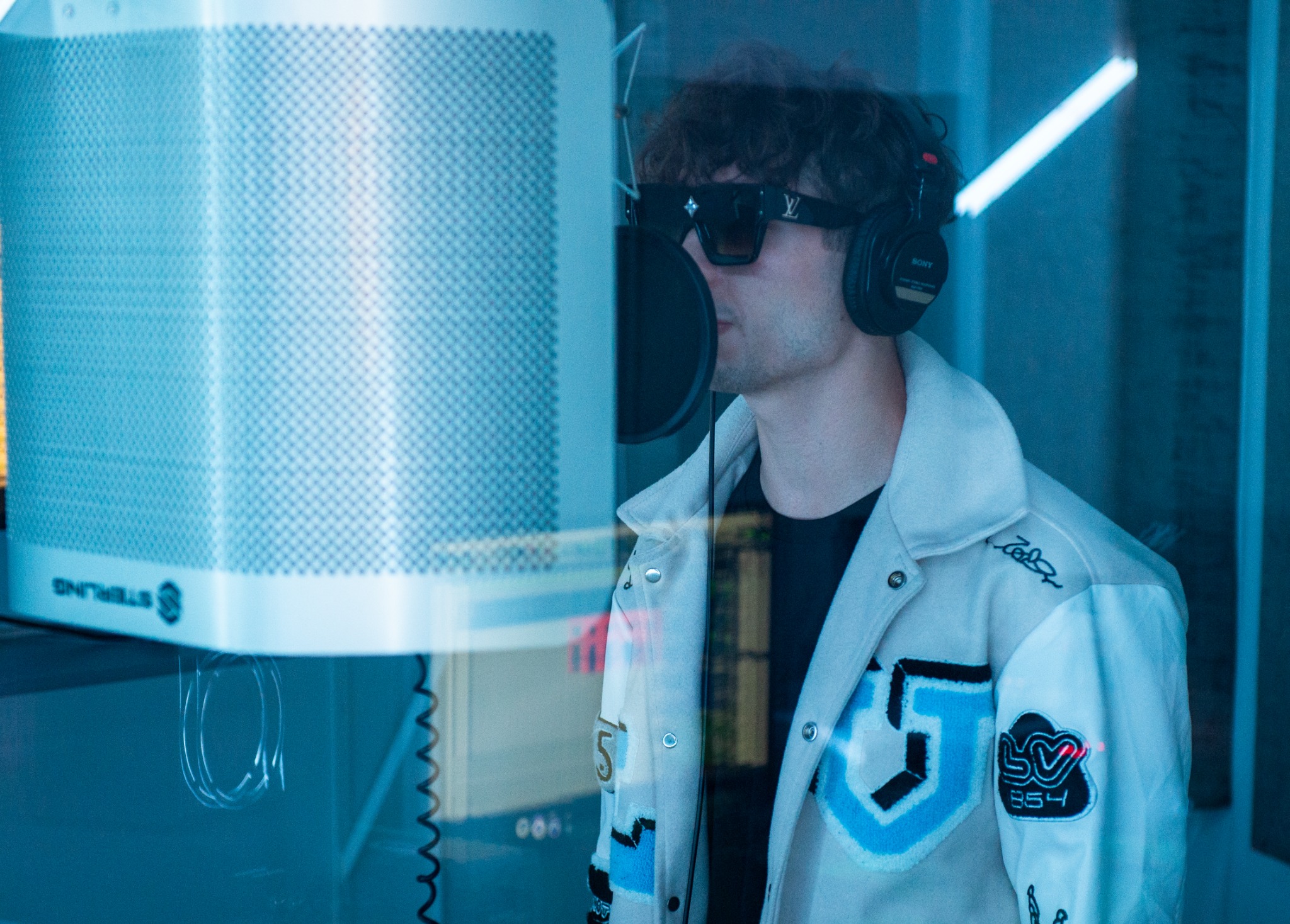 Trev wearing headphones in a recording studio